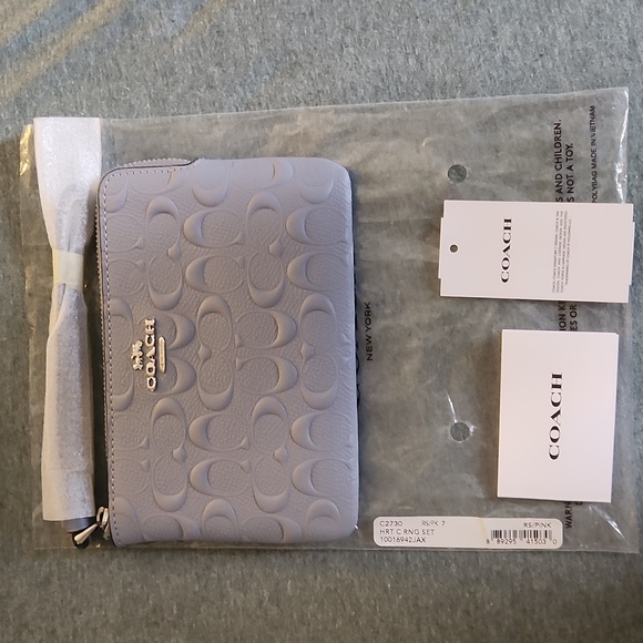 Coach Handbags - Coach Pastel Blue Embossed Pouch